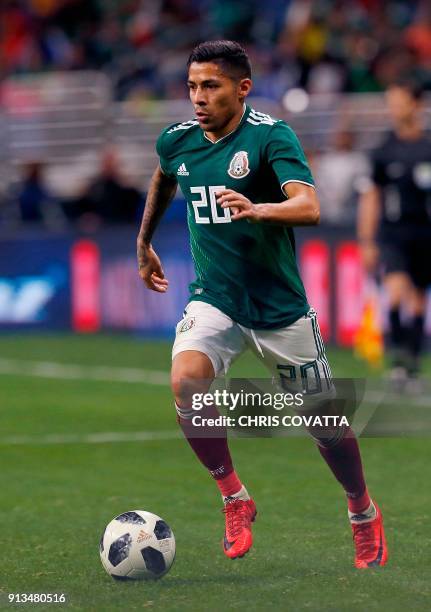 Mexico's Javier Aquino advances the ball against Bosnia & Herzegovina during a friendly football game at the Alamodome in San Antonio, Texas on...