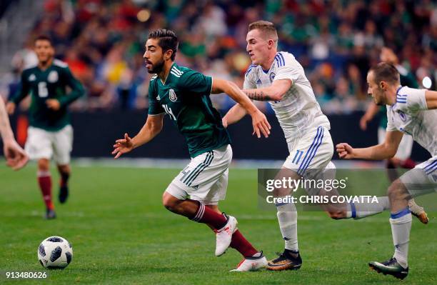 Mexico's Rodolfo Pizarro competes for the ball with Bosnia & Herzegovina's Stjepan Loncar during a friendly football game at the Alamodome in San...