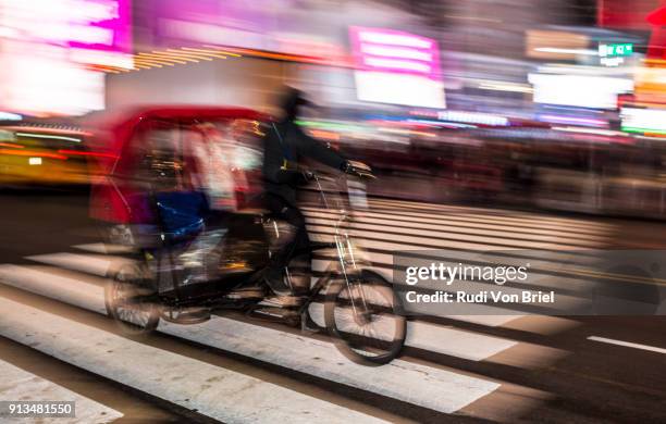 pedicab in times square, nyc. - pedicab stock pictures, royalty-free photos & images