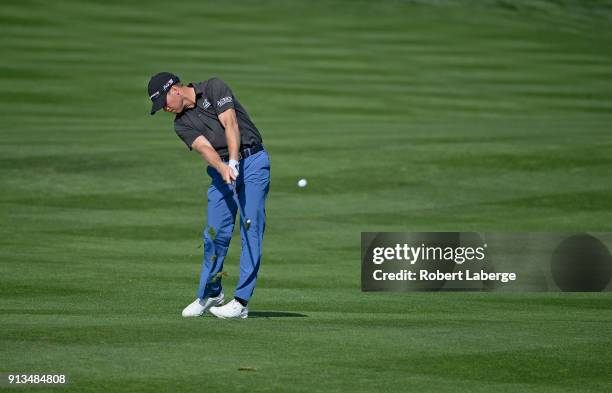 Tyler Duncan hits his second shot on the eighth hole during the second round of the Waste Management Phoenix Open at TPC Scottsdale on February 2,...