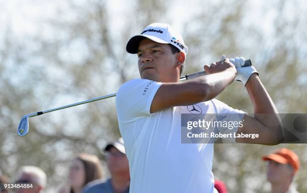 Fabian Gomez of Argentina watches his tee shot on the fourth hole during the second round of the Waste Management Phoenix Open at TPC Scottsdale on...