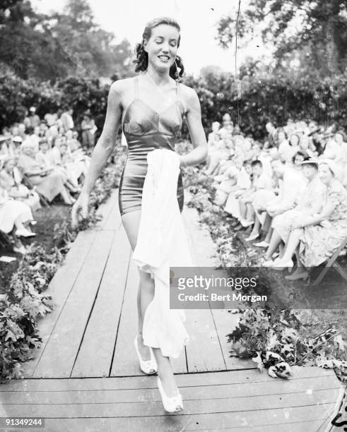 Socialite Edith Beale modeling a bathing suit on a runway in the Easthampton Fair Fashion Show, Easthampton, NY July 29, 1940