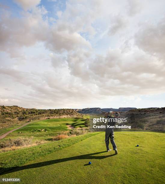 golfer teeing off - tee box stock pictures, royalty-free photos & images