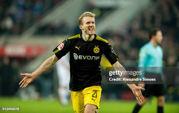 Andre Schuerrle of Borussia Dortmund celebrates scoring the goal to make it 2:3 during the Bundesliga match between 1. FC Koeln and Borussia Dortmund...