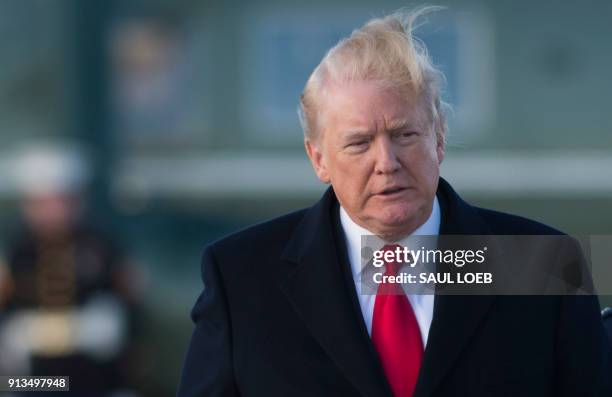 President Donald Trump walks to Air Force One prior to departure from Joint Base Andrews in Maryland, February 2 as he travels to Mar a Lago in West...