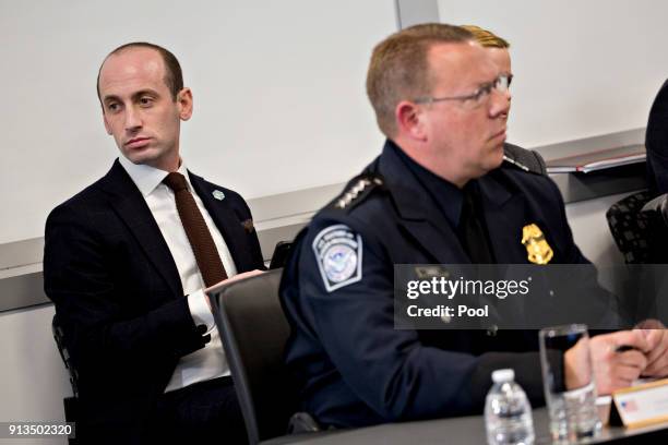 Stephen Miller, White House senior advisor for policy, left, listens during a Customs and Border Protection roundtable discussion with U.S. President...