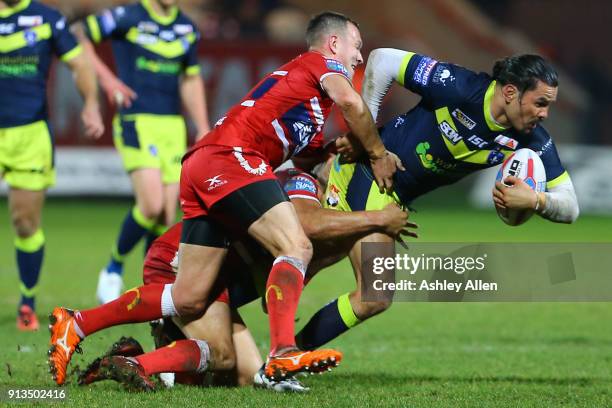 Wakefield Trinity's Justin Horo is tackled by Hull KR's Danny McGuire during the BetFred Super League match between Hull KR and Wakefield Trinity at...