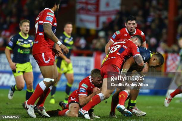 Wakefield Trinity's Reece Lyne is tackled by Hull KR's Ben Kavanagh and Matty Marsh during the BetFred Super League match between Hull KR and...