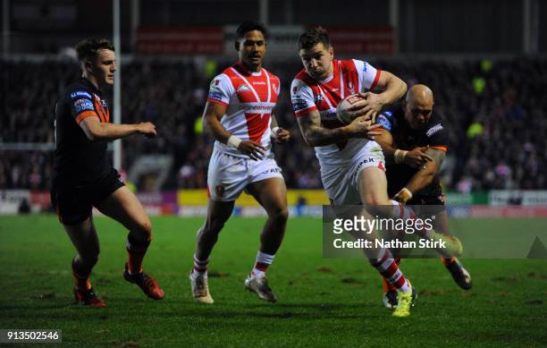 Mark Percival of St Helens breaks through to score their fourth try during the Betfred Super League match between St Helens and Castleford Tigers at...