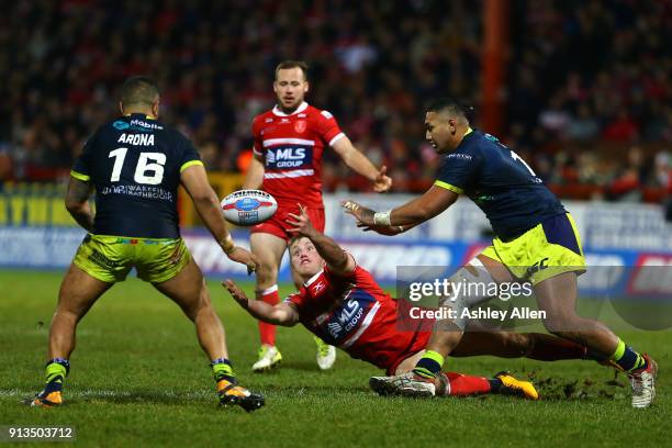 Hull KR's Connor Williams loses control of the ball as Wakefield Trinity's Justin Horo and Tinirau Aronaâ¨ move in to gather the ball during the...