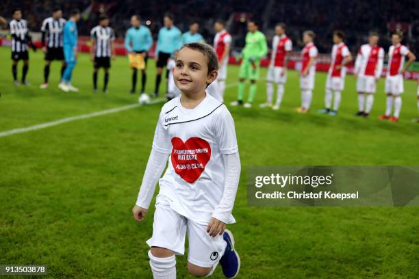 Kids club kid of Duesseldorf runs off the pitch prior to the Second Bundesliga match between Fortuna Duesseldorf and SV Sandhausen at Esprit-Arena on...