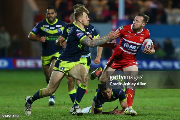 Wakefield Trinity's Tom Johnstone attempts to tackle Hull KR's Adam Quinlan during the BetFred Super League match between Hull KR and Wakefield...