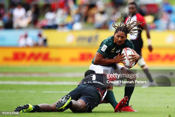 Justin Geduld of South Africa looks to offload the ball during the 2018 New Zealand Sevens at FMG Stadium on February 3, 2018 in Hamilton, New...