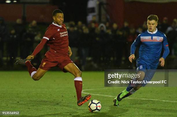 Elijah Dixon-Bonner of Liverpool and James Jennings of Stoke City in action during the Liverpool v Stoke City U18 Premier League game at The Kirkby...