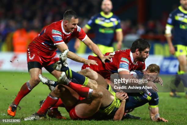 Wakefield Trinity's Kyle Wood is tackled by Hull KR's Danny McGuire ,Lee Jewitt and Chris Clarkson during the BetFred Super League match between Hull...