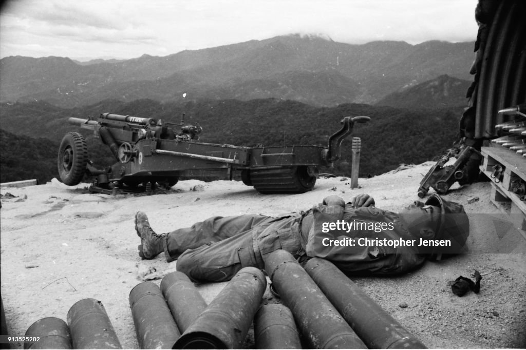 Fsb Ripcord An unidentified US Army soldier sleeps beside 105mm howitzer shells ...