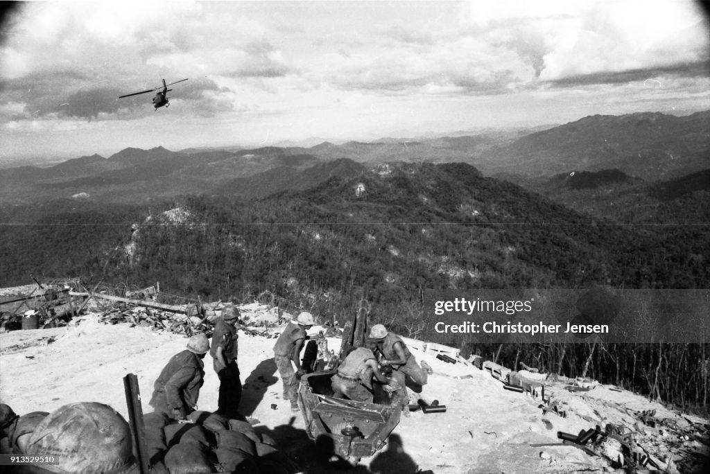 Fsb Ripcord Members of a US artillery crew load a howitzer to provide cover for a ...