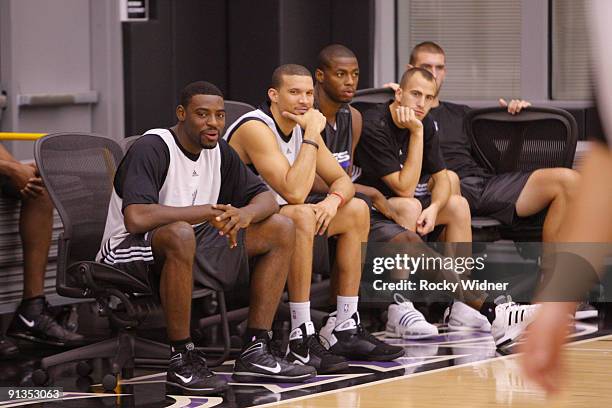 Tyreke Evans, Francisco Garcia, Desmond Mason, Sergio Rodriguez and Spencer Hawes of the Sacramento Kings watch the action during training camp on...