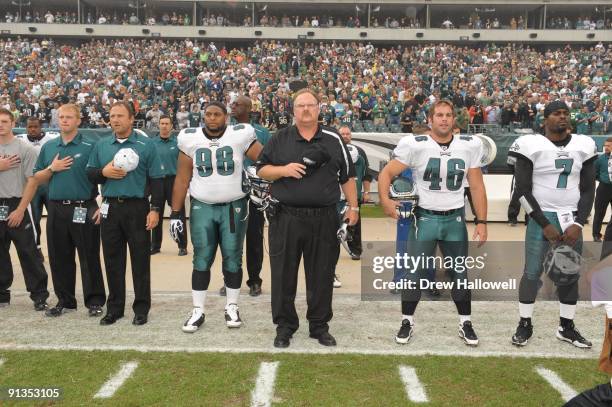 Defensive tackle Mike Patterson, head coach Andy Reid, center Jon Dorenbos and quarterback Michael Vick of the Philadelphia Eagles observe the...