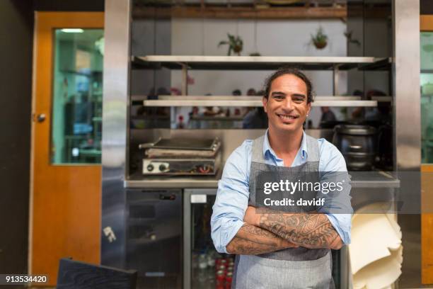 confident business man working in a cafe business - maori business stock pictures, royalty-free photos & images