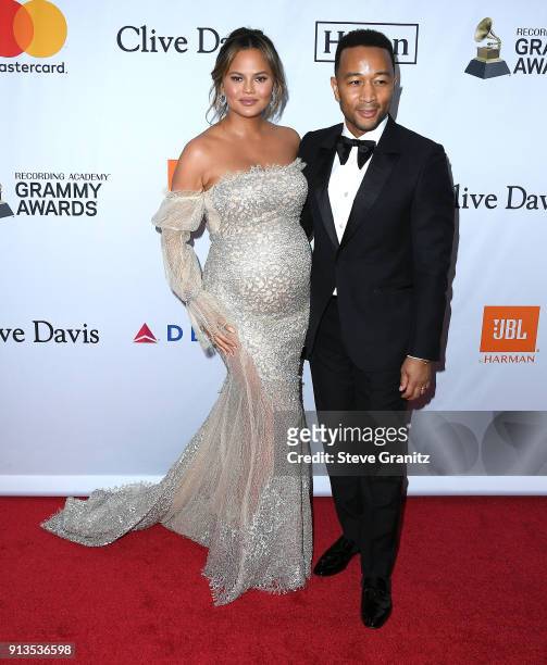 Chrissy Teigen;John Legend arrives at the Clive Davis and Recording Academy Pre-GRAMMY Gala on January 27, 2018 in New York City.