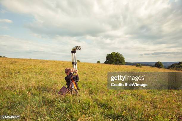 young british business boy with periscope - periscope stock pictures, royalty-free photos & images