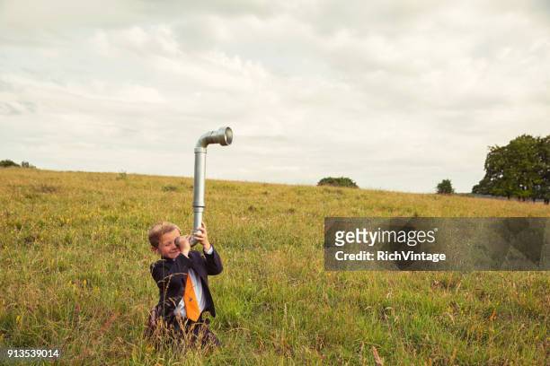 young british business boy with periscope - periscope stock pictures, royalty-free photos & images