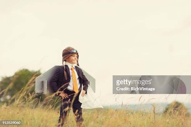young british business boy wearing jet pack - intellectual ventures stock pictures, royalty-free photos & images