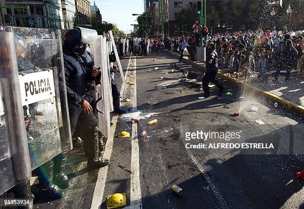 Students clash police during the anniversary of the massacre of Tlatelolco, at the Plaza de las Tres Culturas, in Mexico City, on October 2, 2009....