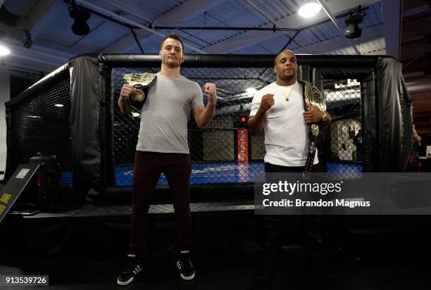 Stipe Miocic and Daniel Cormier pose for the media during the The Ultimate Fighter: Undefeated Cast & Coaches Media Day inside the UFC Performance...