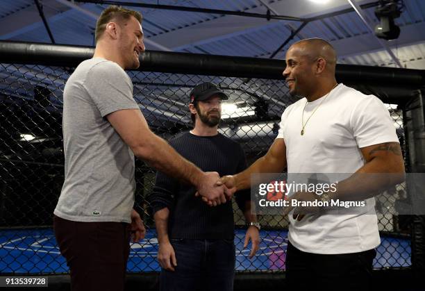 Stipe Miocic and Daniel Cormier shake hands during the The Ultimate Fighter: Undefeated Cast & Coaches Media Day inside the UFC Performance institute...