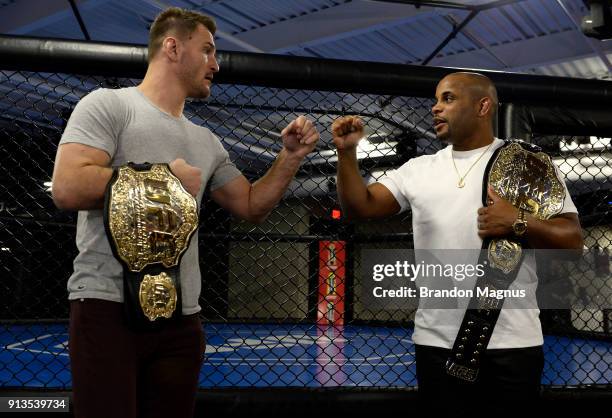 Stipe Miocic and Daniel Cormier bump fists during the The Ultimate Fighter: Undefeated Cast & Coaches Media Day inside the UFC Performance institute...