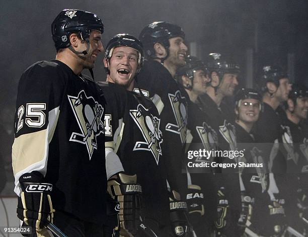 Matt Cooke of the Pittsburgh Penguins jokes with Maxime Talbot during the 2008-2009 Stanley Cup Champion banner raising ceremony prior to the game...