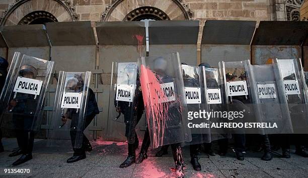 Students clash with the police during the anniversary of the massacre of Tlatelolco, at the Plaza de las Tres Culturas, in Mexico City, on October 2,...