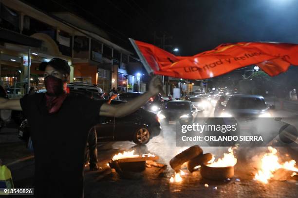 Members of the Opposition Alliance Against the Dictatorship mount roadblocks during a protest held to demand that reelected President Juan Orlando...