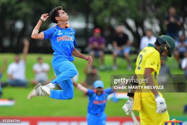 India's Kamlesh Nagarkoti celebrates Australia's captain Jason Sangha being caught during the U19 World Cup cricket final match between India and...