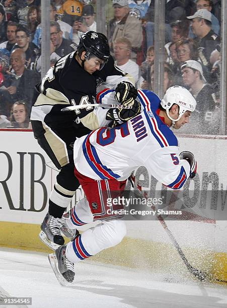 Chris Kunitz of the Pittsburgh Penguins collides with Dan Girardi of the New York Rangers on October 2, 2009 at Mellon Arena in Pittsburgh,...
