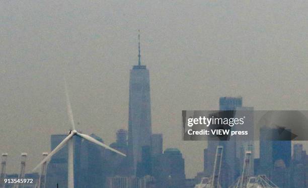 View of a wind turbine is seen from Bayonne Bridge as the New York City Skyline is seen on the background on February 01, 2018 in Bayonne, New...