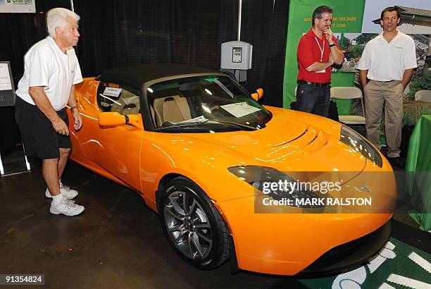 Tesla Roadster car which is electric powered with a range of 244 miles and a top speed of 125 mph, on display at the fourth annual AltCar Expo in Los...