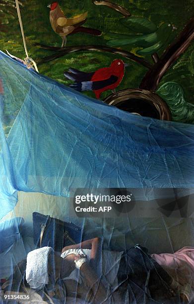 Alejandra Melgar is seen in the children's ward for patients with dengue fever in the La Mascota hospital in Managua on October 2, 2009. Nicaraguan...