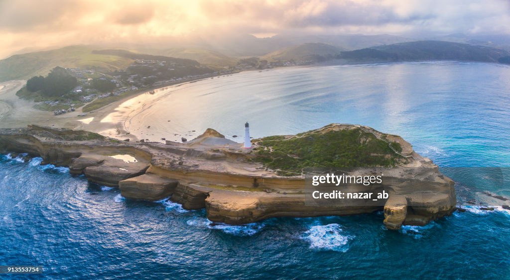 Aerial Panoramic view of Castlepoint Lighthouse with Castlepoint village in background.