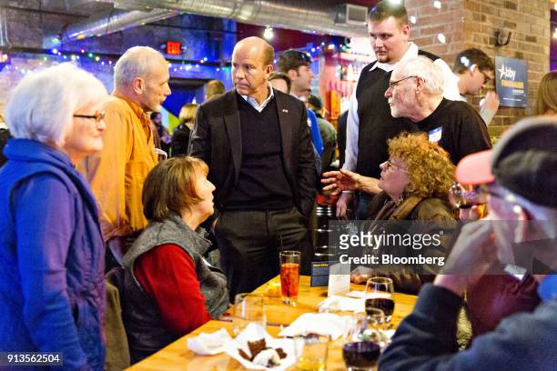 Representative John Delaney, a Democrat from Maryland and 2020 presidential candidate, center, speaks to attendees during a fundraiser for Abby...