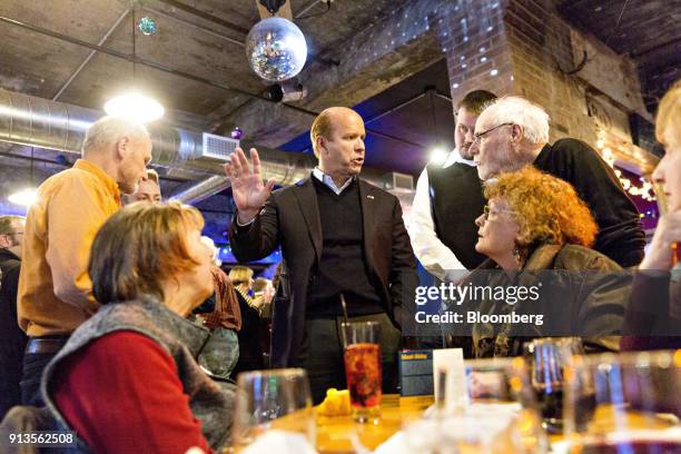 Representative John Delaney, a Democrat from Maryland and 2020 presidential candidate, center, speaks to attendees during a fundraiser for Abby...