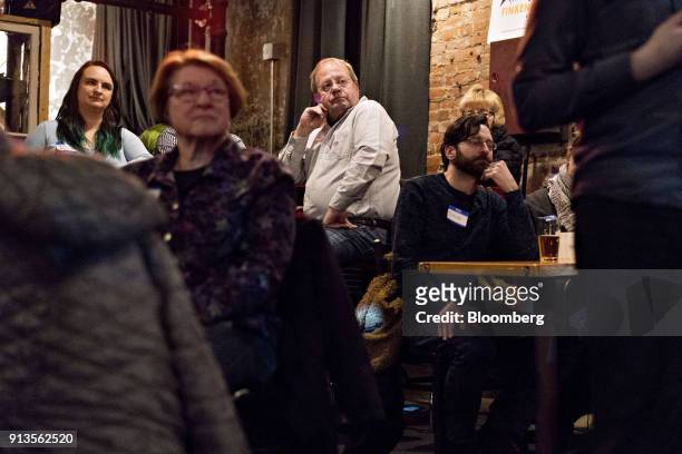 Attendees listen as Representative John Delaney, a Democrat from Maryland and 2020 presidential candidate, not pictured, speaks during a fundraiser...
