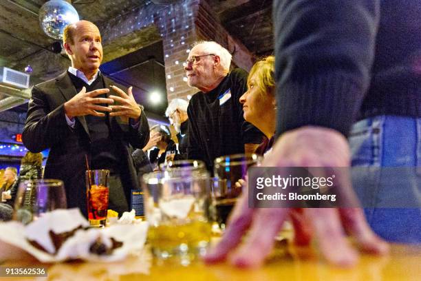 Representative John Delaney, a Democrat from Maryland and 2020 presidential candidate, left, speaks to attendees during a fundraiser for Abby...