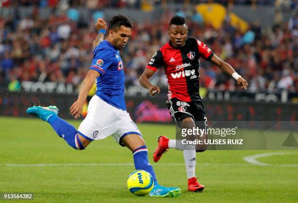 Cliffor Aboagye of Atlas vies for the ball with Walter Montoya of Cruz Azul during their Mexican Clausura 2018 tournament football match at the...