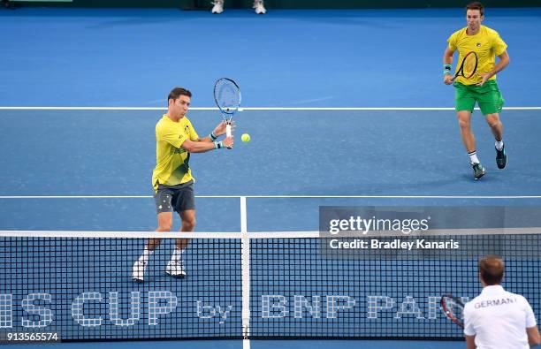 Matt Ebden of Australia plays a backhand volley in the doubles match with John Peers against Jan-Lennard Struff and Tim Putz of Germany during the...