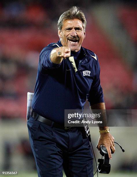 Dave Wannstedt the Head Coach of the Pittsburgh Panthers coaches from sideline during the Big East Conference game against the Louisville Cardinals...