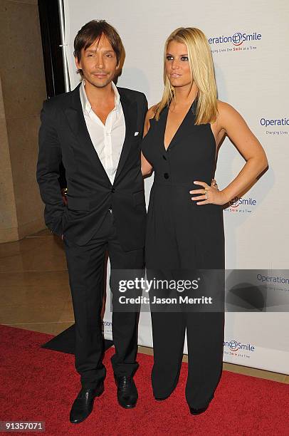 Ken Paves and Singer Jessica Simpson arrives at Operation Smile's 8th Annual Smile Gala at the Beverly Hills Hilton Hotel on October 2, 2009 in...