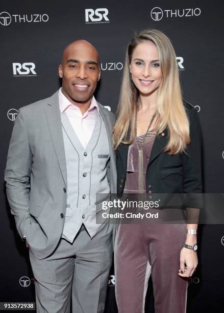 Tiki Barber and Traci Lynn Johnson arrive at the Thuzio & Rosenhaus Party during Super Bowl weekend at The Exchange & Alibi Lounge on February 2,...